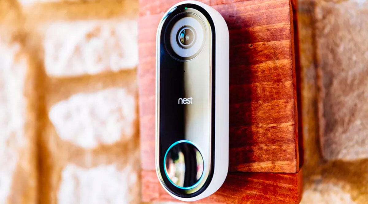 The Nest Hello video doorbell mounted outside of a home.