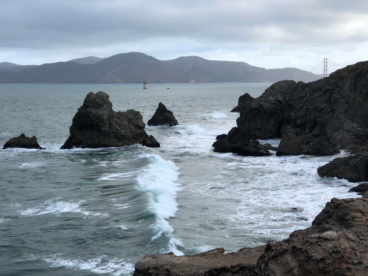 Waves crash along the rocky coast at Land's End in San Francisco.