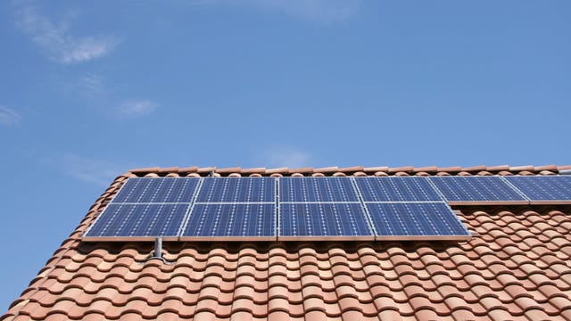 Solar panels on a tile roof.