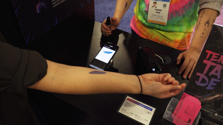 Simple handheld device delivers temporary tattoos in seconds