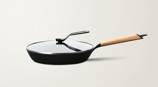 A Vermicular frying pan and lid against a plain background.