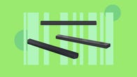 A variety of soundbars are displayed against a green background.