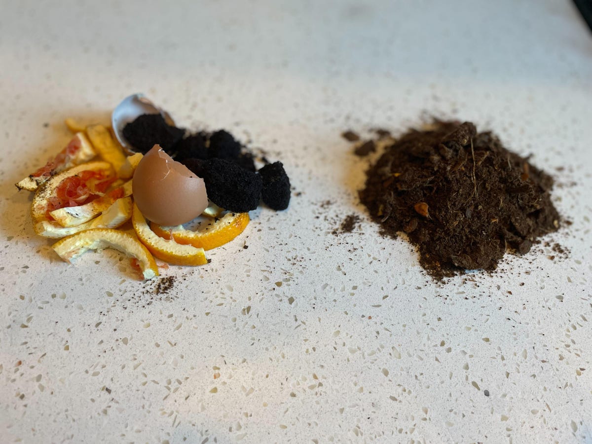 a pile of food scraps next to a pile of processed dirt