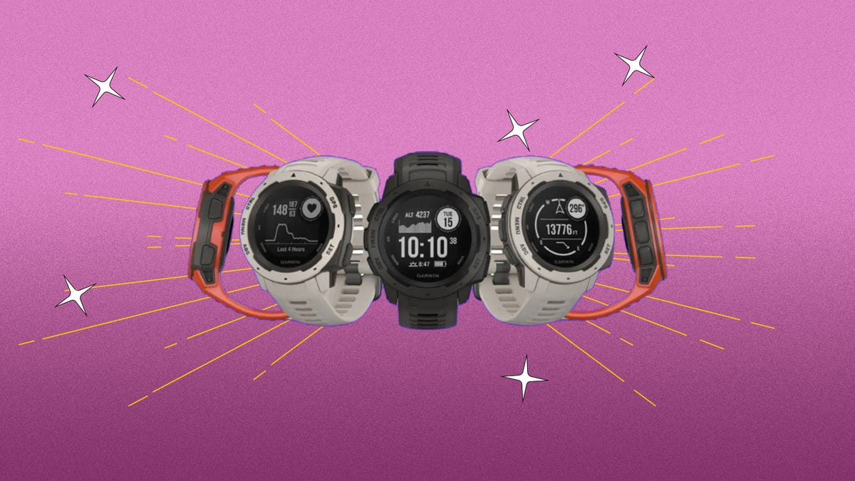 A collection of orange, white and black Garmin fitness trackers against a purple background.