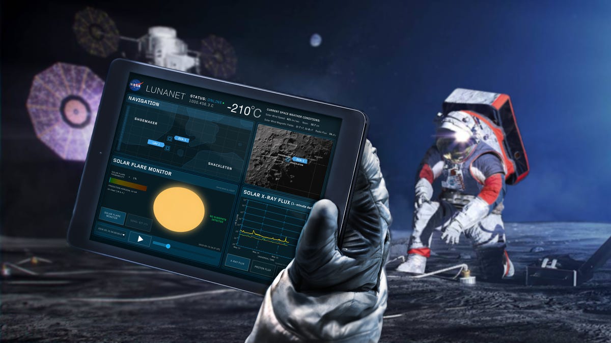 An illustration of astronauts on the moon, one in the background and one behind the "camera" so we get their point-of-view. In the latter's hand, we see a tablet with the so-called LunaNet held up to the "camera."