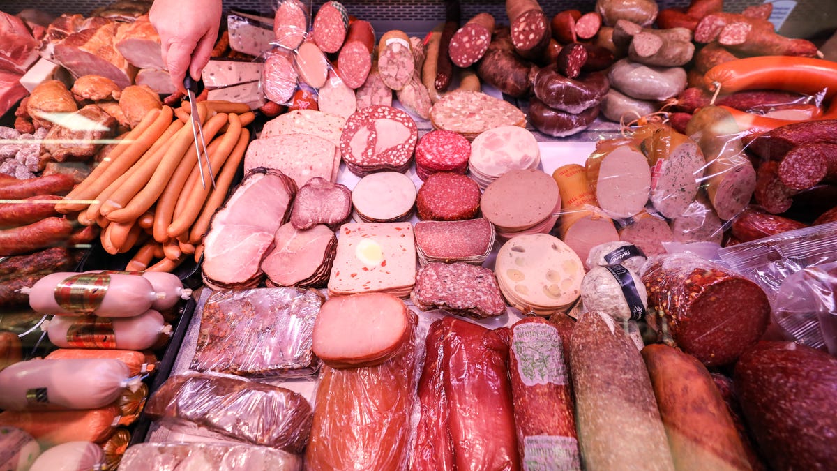 An array of pink and light brown deli meats