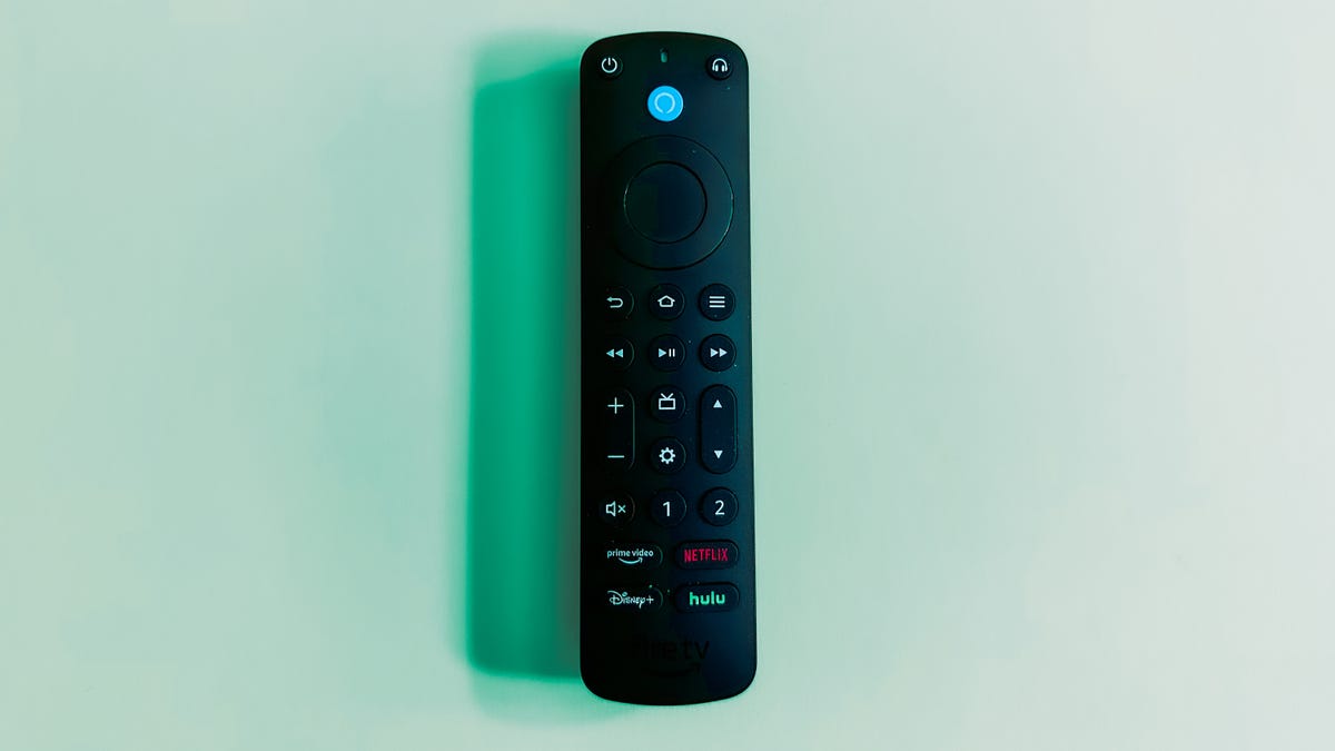 Amazon Fire TV Alexa Voice Remote Pro on a green background.