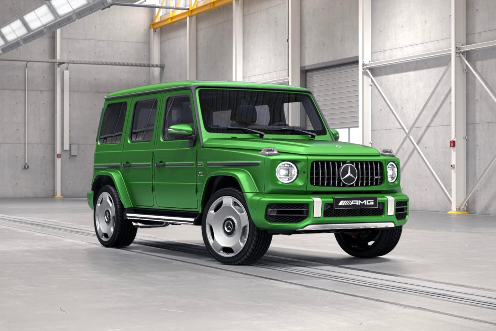 Front 3/4 view of a green Mercedes-AMG G63 showing new monoblock wheels