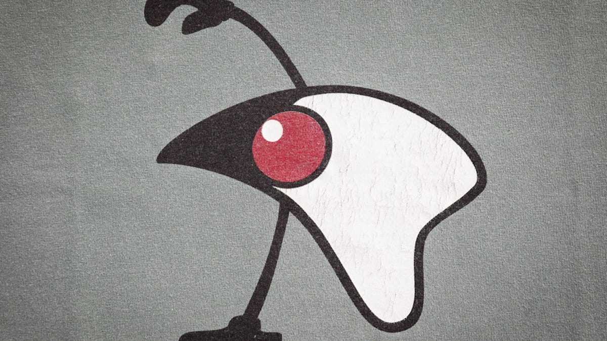 The eyeless, mouthless Java mascot named Duke cartwheels across a T-shirt from a JavaOne conference.