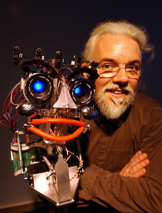 Noel Sharkey with 'eMo' the Robot