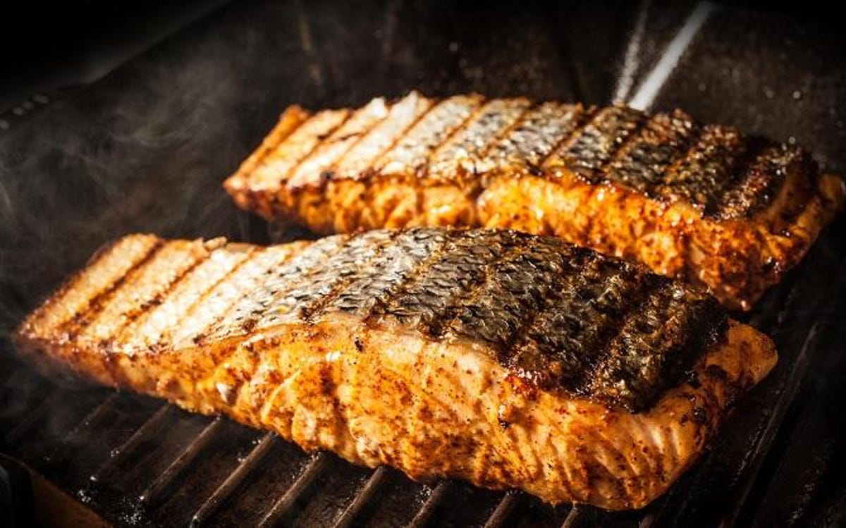 two salmon filets on grill