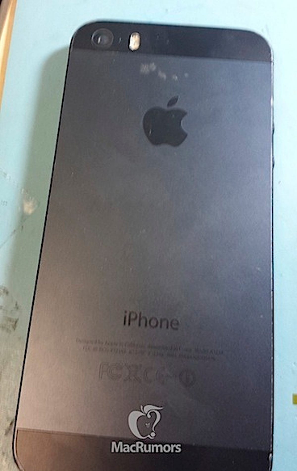MacRumors claims this is a photo of the iPhone 5S' rear shell, which makes room for a larger, dual-LED flash at top.