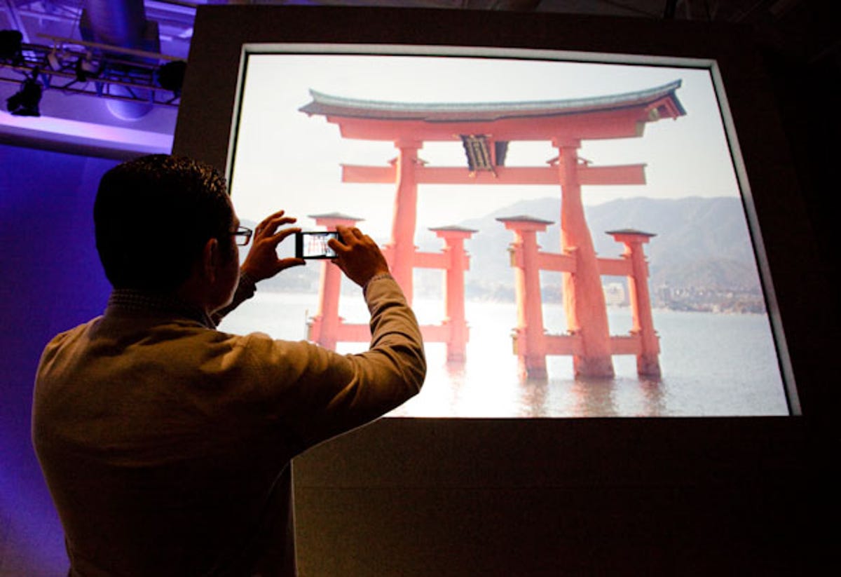 Vic Gundotra, Google's vice president of engineering, takes a photo of the Itsukushima Shrine in Japan. The Google Goggles feature successfully identified it.