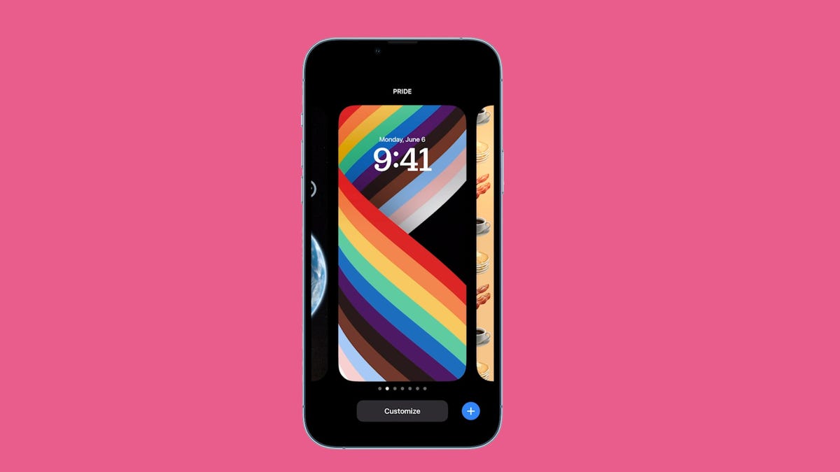 An iPhone showing the new lock screen in iOS 16 against a pink background