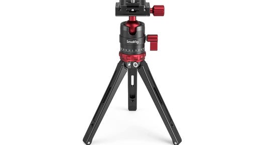 A red and black metal tripod