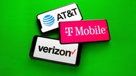 AT&T, T-Mobile and Verizon logos on three phones