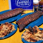 two slabs of ribs and two plates of pulled pork