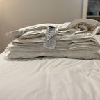 Brooklinen comforter on white bed