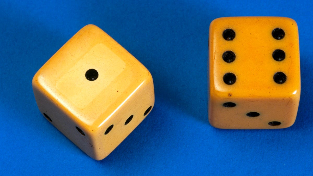 A pair of dice made in imitation ivory celluloid, early 20th century.