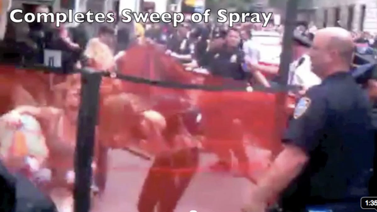 Slow-motion video shows a New York police officer spraying women in the face with pepper spray in a holding area at an Occupy Wall Street protest.