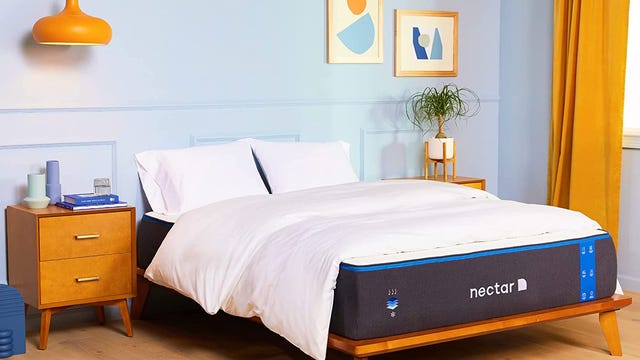 The Nectar mattress in a nice, bright room