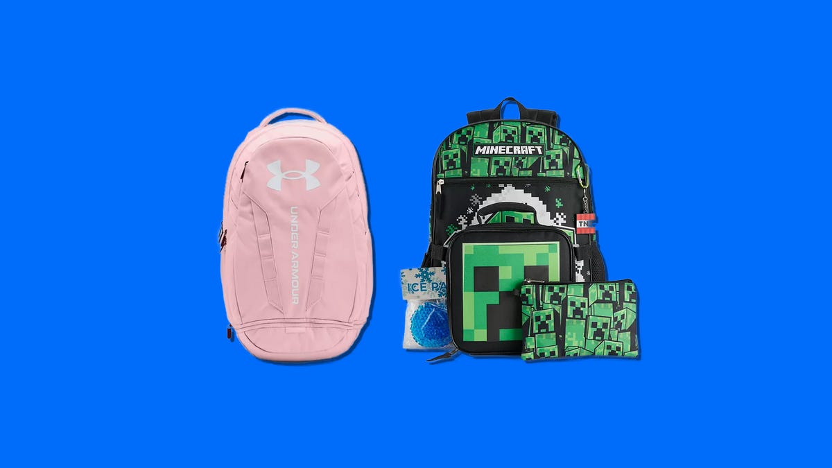 A pink Under Armour backpack and a black and green Minecraft backpack on a blue background