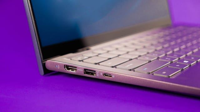 Dell Inspiron 14 2-in-1 laptop on a purple background
