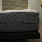 A queen size GhostBed Luxe mattress on an adjustable bed frame