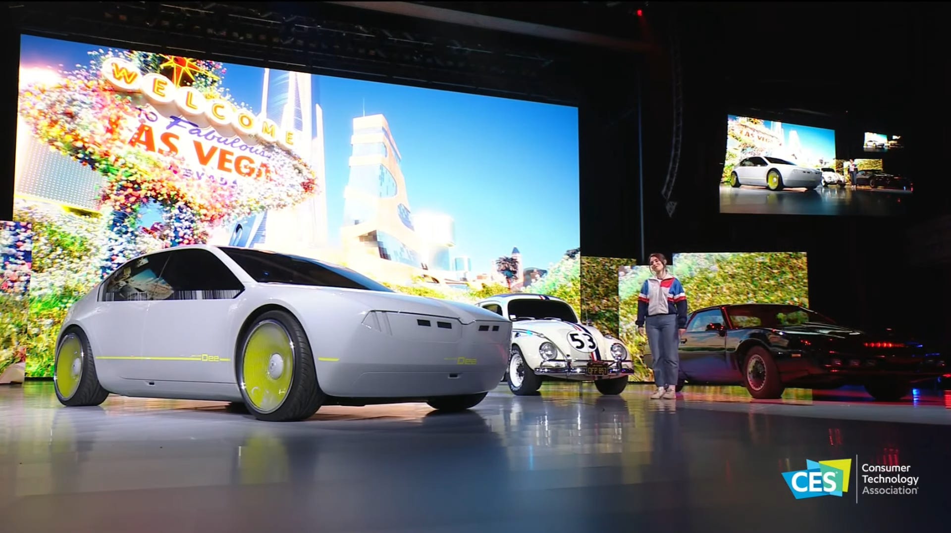 BMW's Dee car with personality on stage with Hollywood cars Herbie and KITT (from Knight Rider).