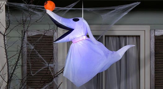 The Nightmare Before Christmas Zero hanging inflatable hands from a porch.