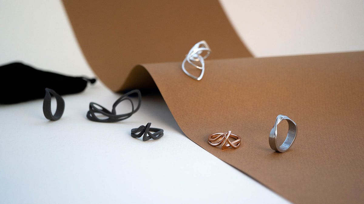 A collection of 3d printed rings. Some in nylon, others in silver and bronze