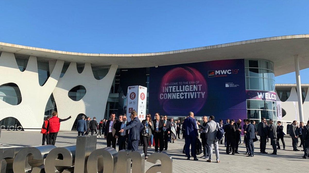 A crowd outside an MWC building in 2019.