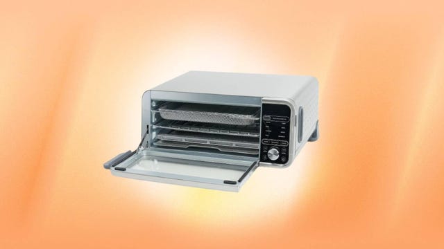 The Ninja Foodi XL 10-in-1 Flip Digital Air Fry Smart Oven Pro with Rack and Probe is displayed against an orange background.