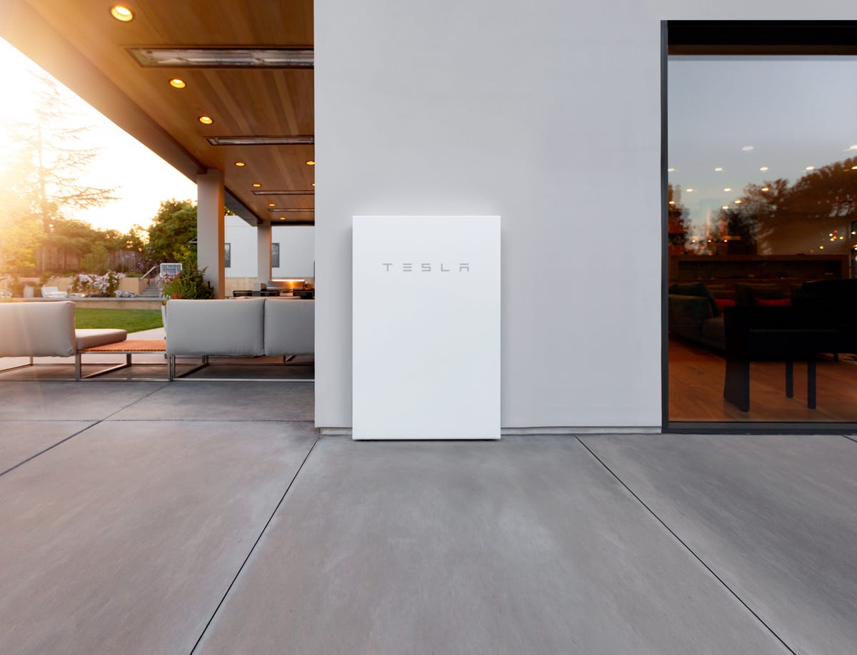 tesla powerwall 2 installed on a home outdoors