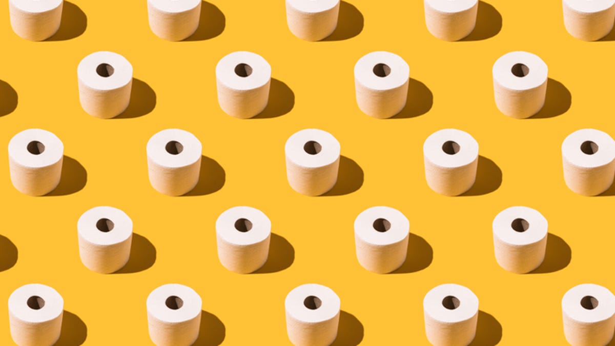 Rows of toilet paper across a yellow background.