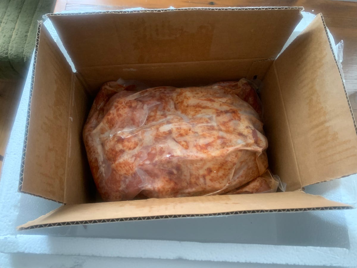 frozen turducken wrapped in plastic in a box