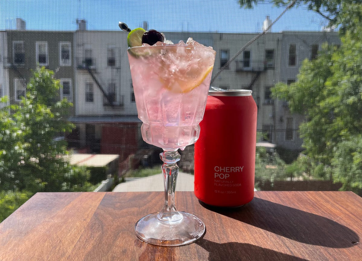cocktail and cherry soda can