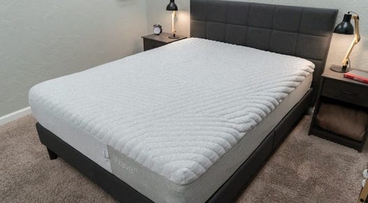 A queen size Casper Wave mattress in a bedroom