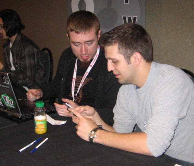TippingPoint sponsors the Pwn2Own contest at CanSecWest every year, providing cash prizes to researchers for successful exploits. Dino Dai Zovi (left) won the contest two years ago. He helped out during the contest this year and is shown here consulting with TippingPoint security researcher Aaron Portnoy during a mobile-phone hack attempt.