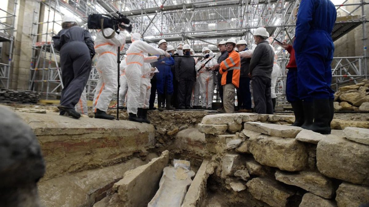 France's culture minister visits the Notre Dame Cathedral archaeological research site after the discovery of a 14th century lead sarcophagus.