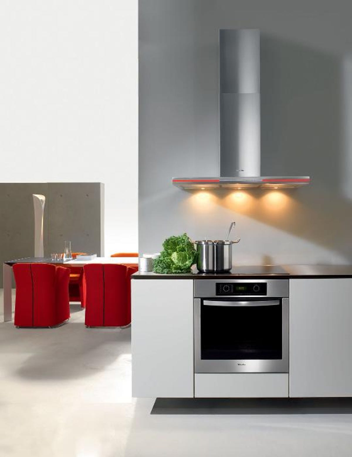 The Miele Lumen range hood with red and blue light