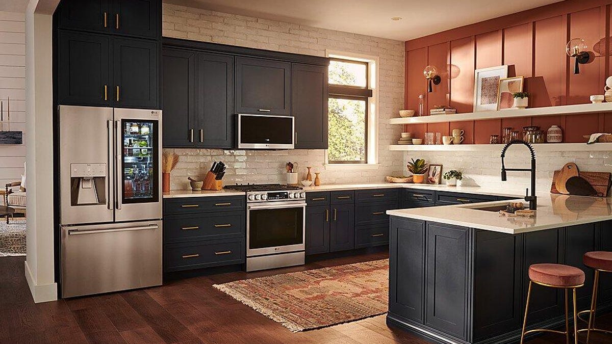 A kitchen equipped with an LG Studio fridge, oven and microwave.