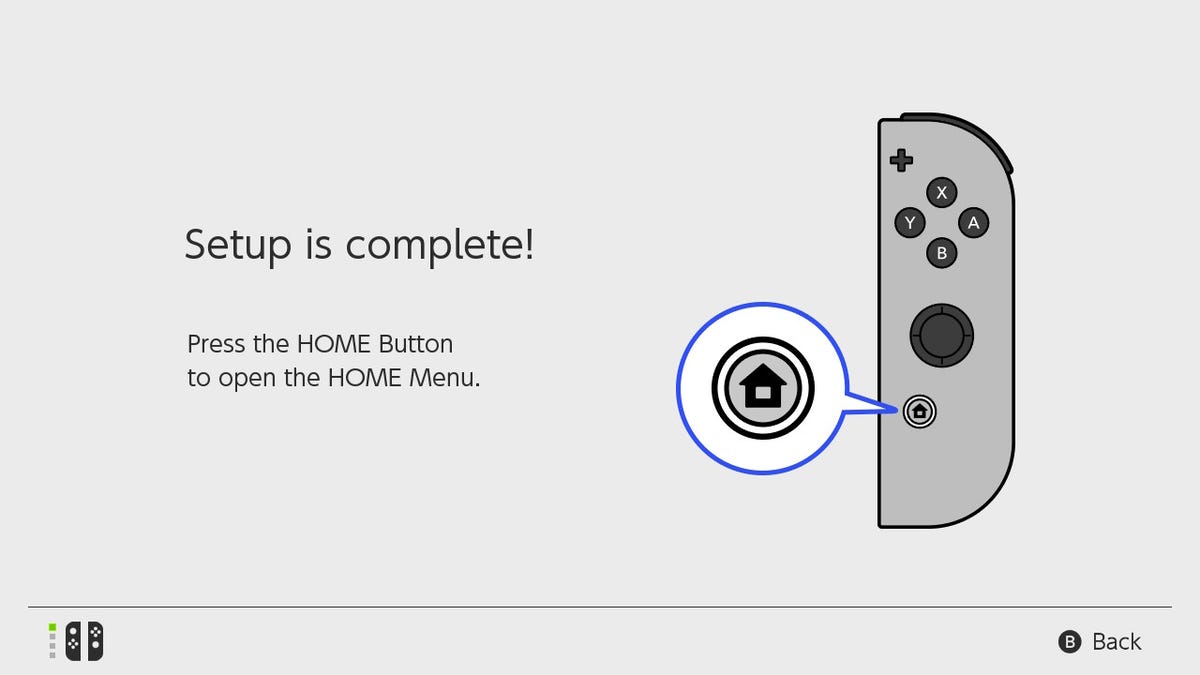 Switch OLED "Setup is complete!" screen: "press the home button to open the home menu"
