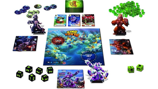 Board game with bright green dice and monsters apiece
