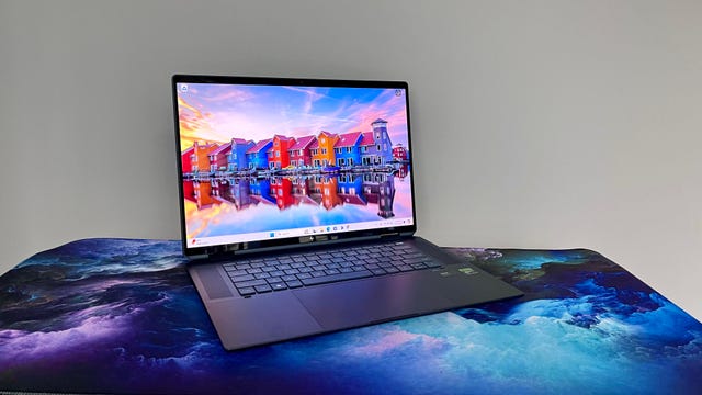 HP Spectre x360 16 2-in-1 at a angle on a cloudy desk mat