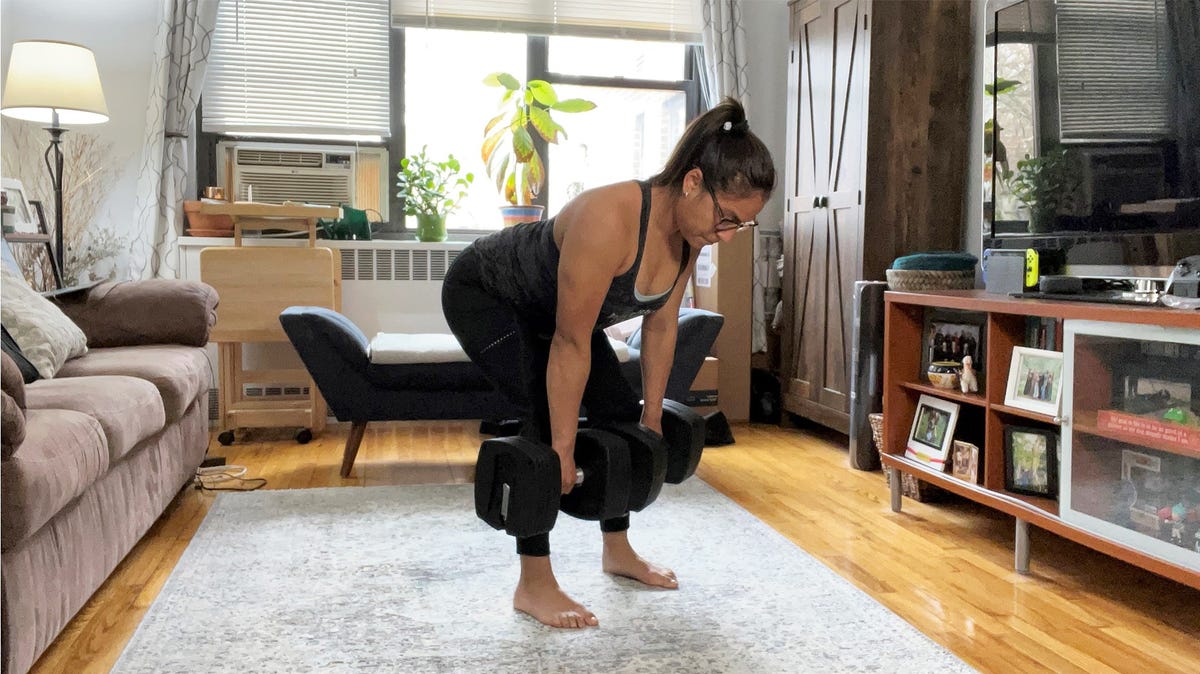 Writer Giselle Castro-Sloboda does a Romanian deadlift with the Nordictrack adjustable dumbbells.