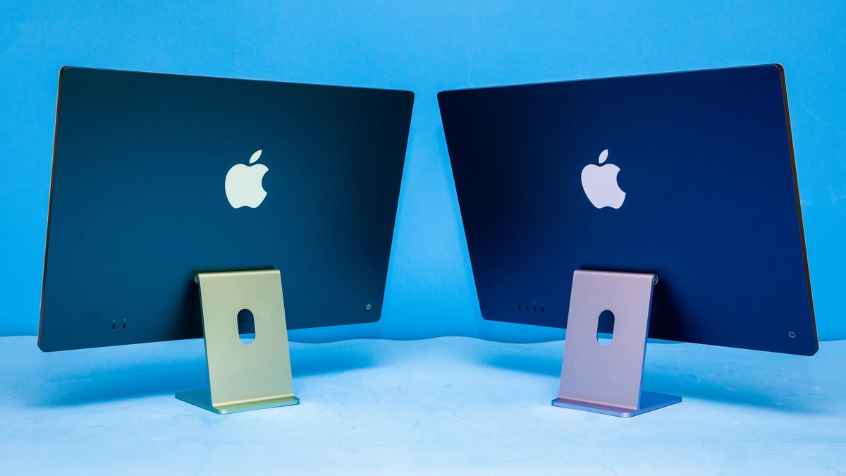 backs of two Apple iMacs