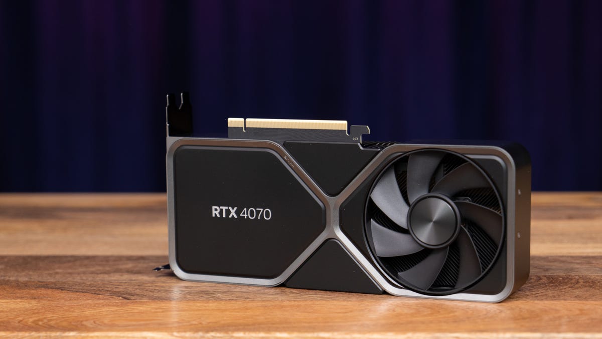 The RTX 4070 FE facing forward, logo side facing you, angled up to your right, on a wood surface with a dark purple background
