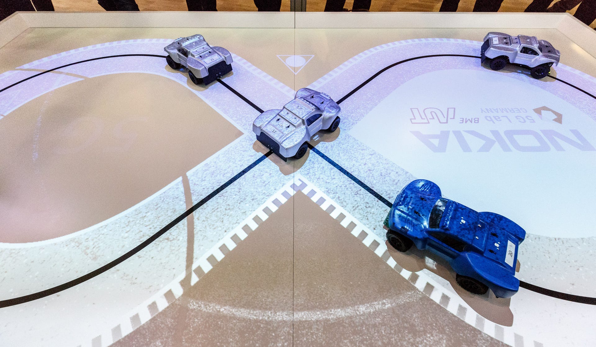 Nokia​ demonstrates how 5G networks are fast enough to coordinate toy cars whizzing through an intersection without colliding.