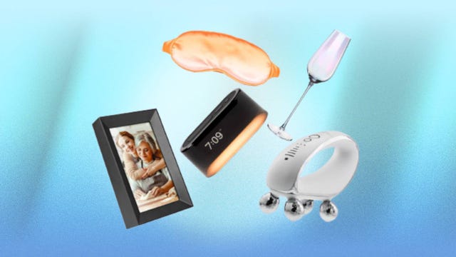 A selection of Brookstone items including a digital photo frame, a wine glass, a sleep mask and more are displayed against a blue background.